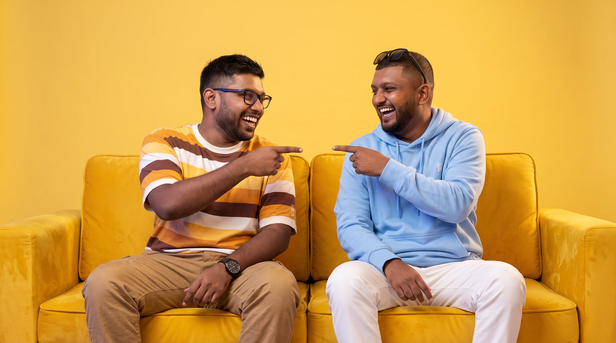 Menuka and Nawan on the yellow sofa